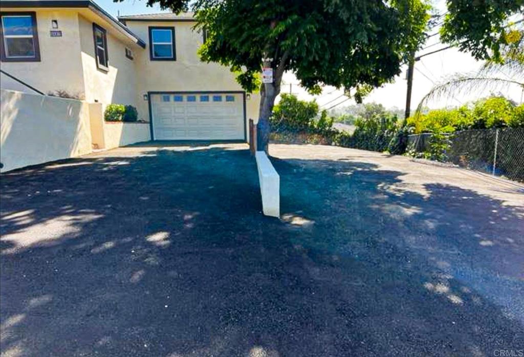 2687 Littleton Road El Cajon, CA 92020 - Photo 5 of 24 a view of a house with backyard and tree