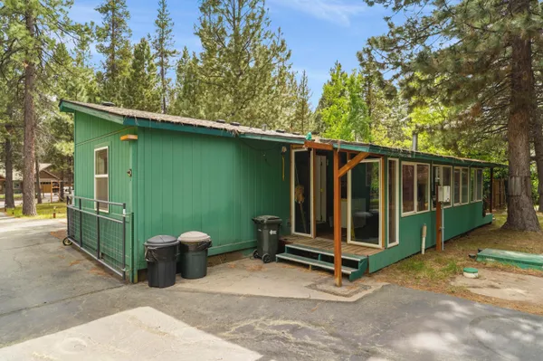 a view of a backyard with a small cabin