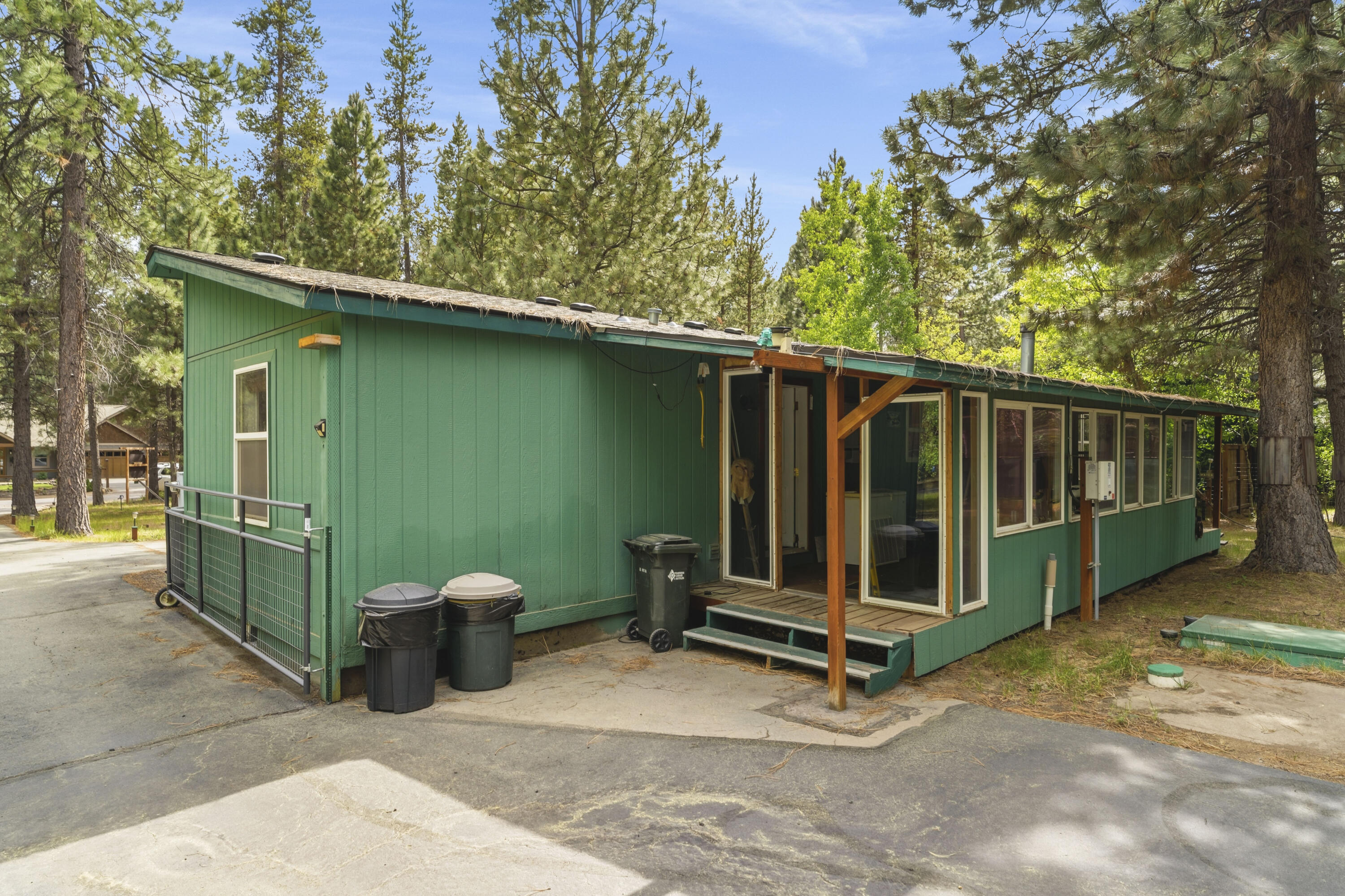 16928 Covina Road Bend, OR 97707 - Photo 1 of 48 a view of a backyard with a small cabin