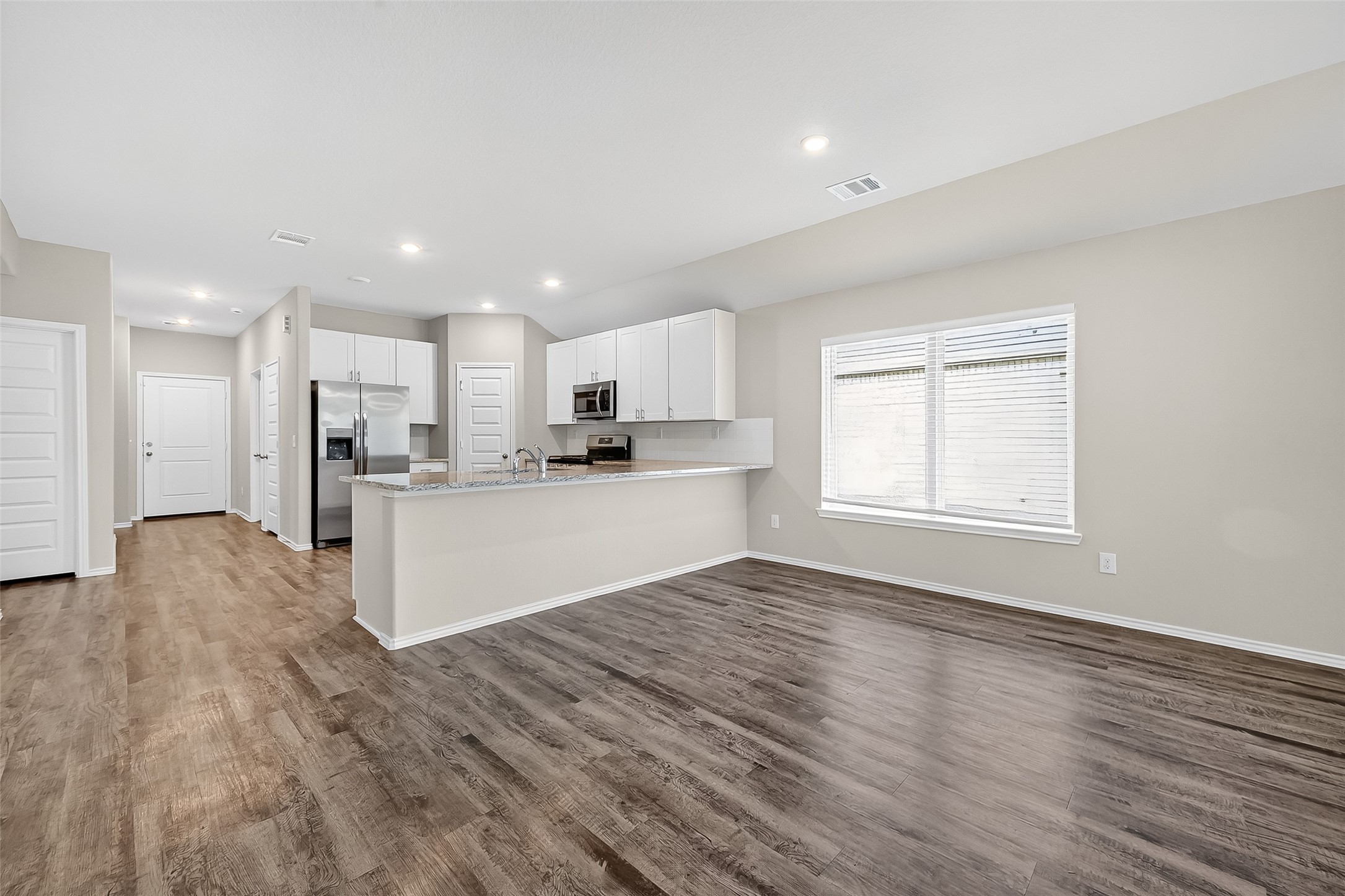 79 Courageous Way Magnolia, TX 77355 - Photo 9 of 23 a view of kitchen with wooden floor