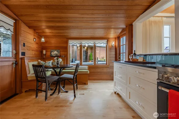 a view of a dining room with furniture and window