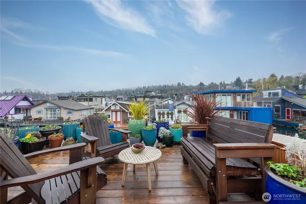 a view of a balcony with outdoor seating
