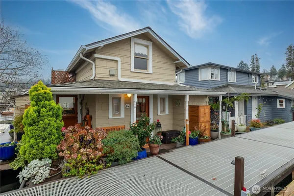 a view of a house with potted plants