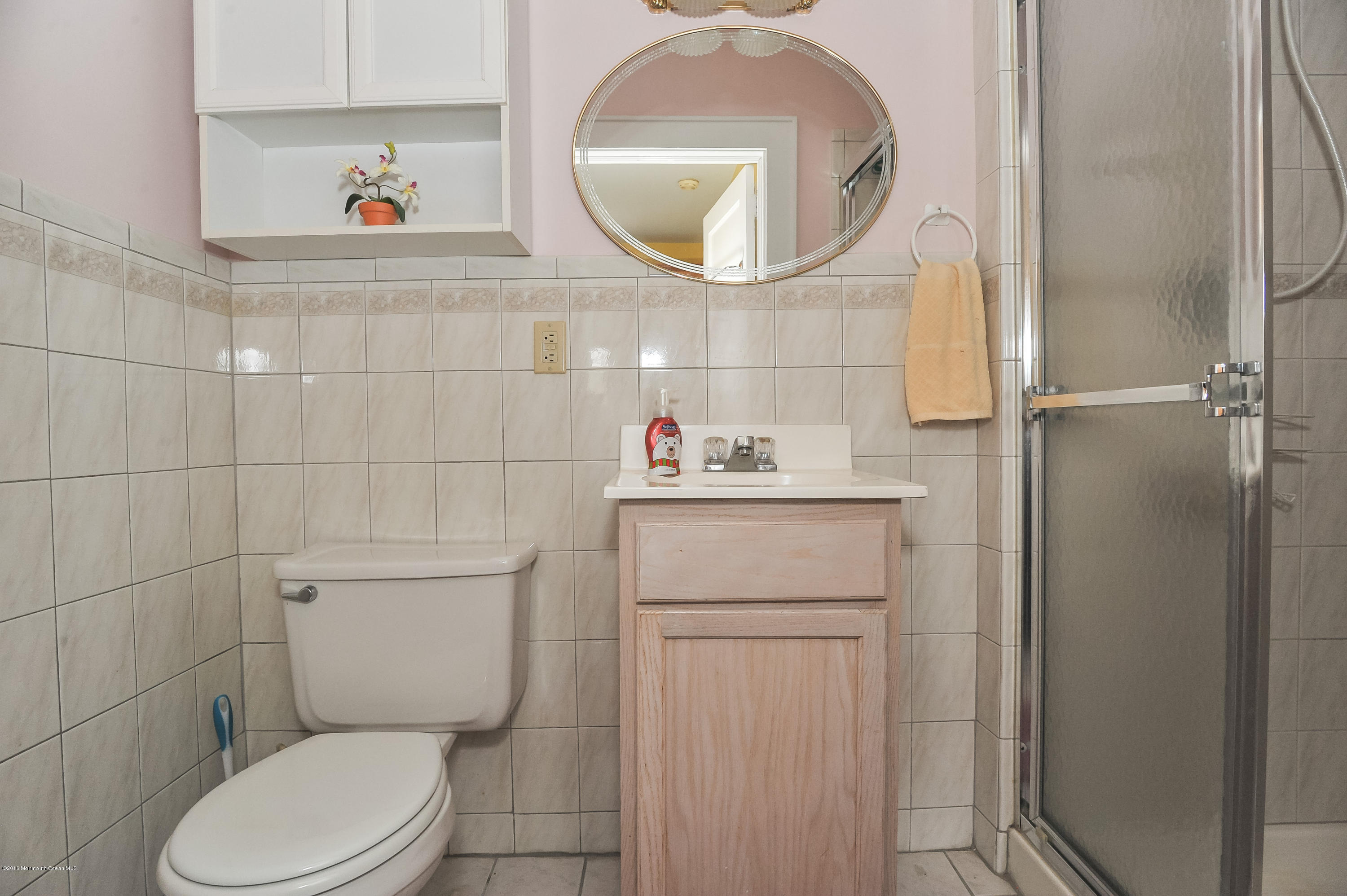 500 Adelphia Road Freehold, NJ 07728 - Photo 11 of 29 a bathroom with a toilet sink and mirror