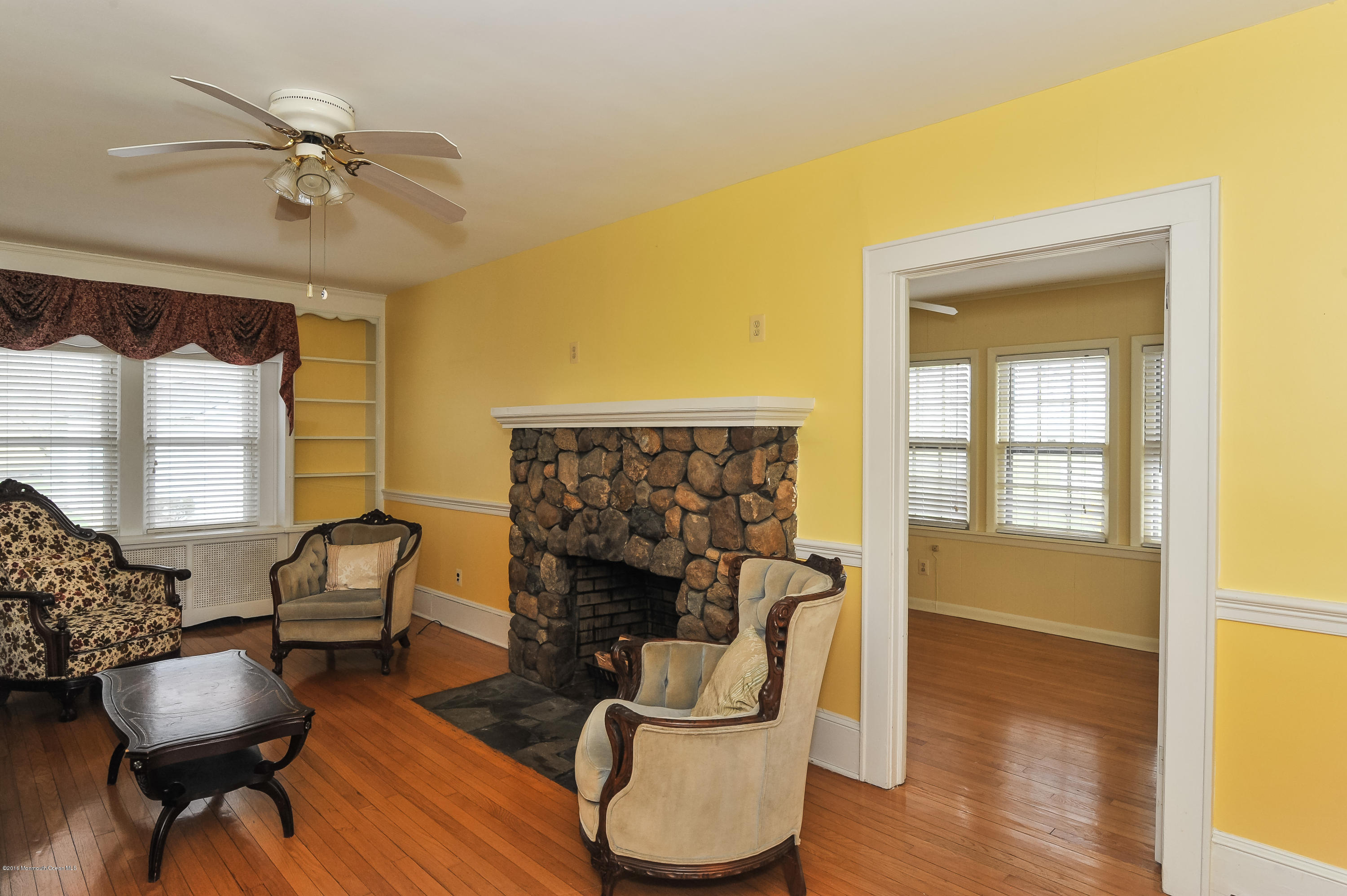 500 Adelphia Road Freehold, NJ 07728 - Photo 15 of 29 a living room with furniture and a fireplace