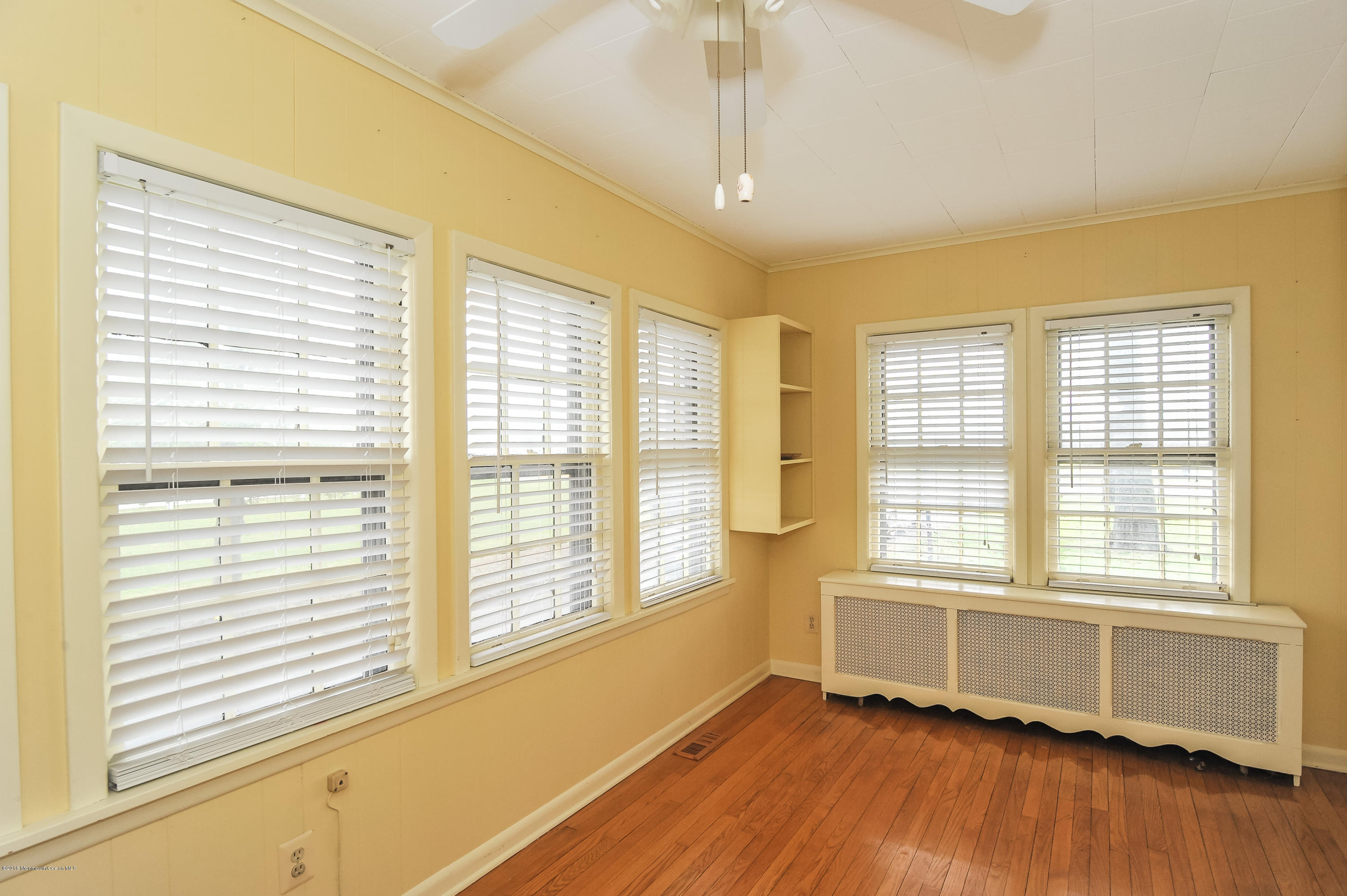 500 Adelphia Road Freehold, NJ 07728 - Photo 16 of 29 a view of an empty room with wooden floor and a window