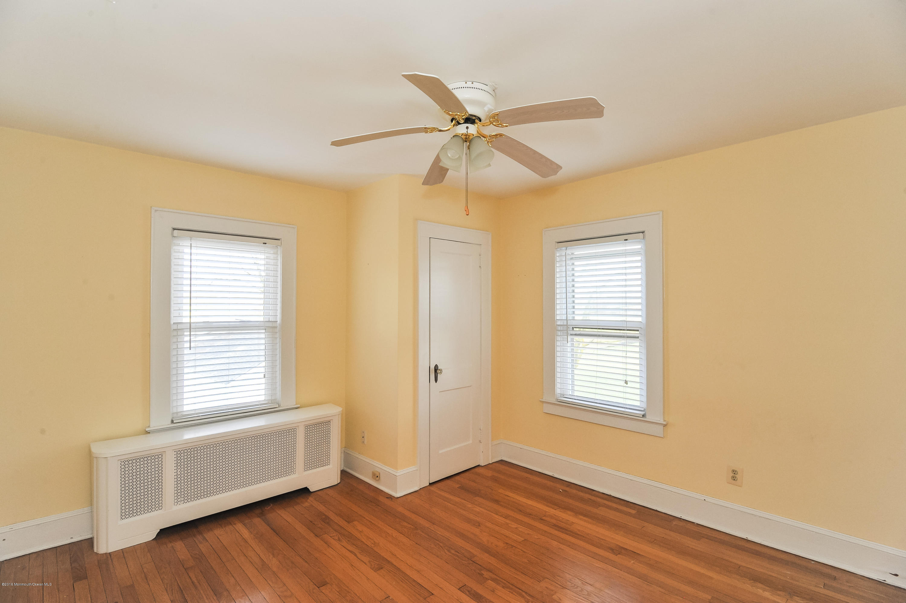 500 Adelphia Road Freehold, NJ 07728 - Photo 18 of 29 a view of an empty room with a window and wooden floor