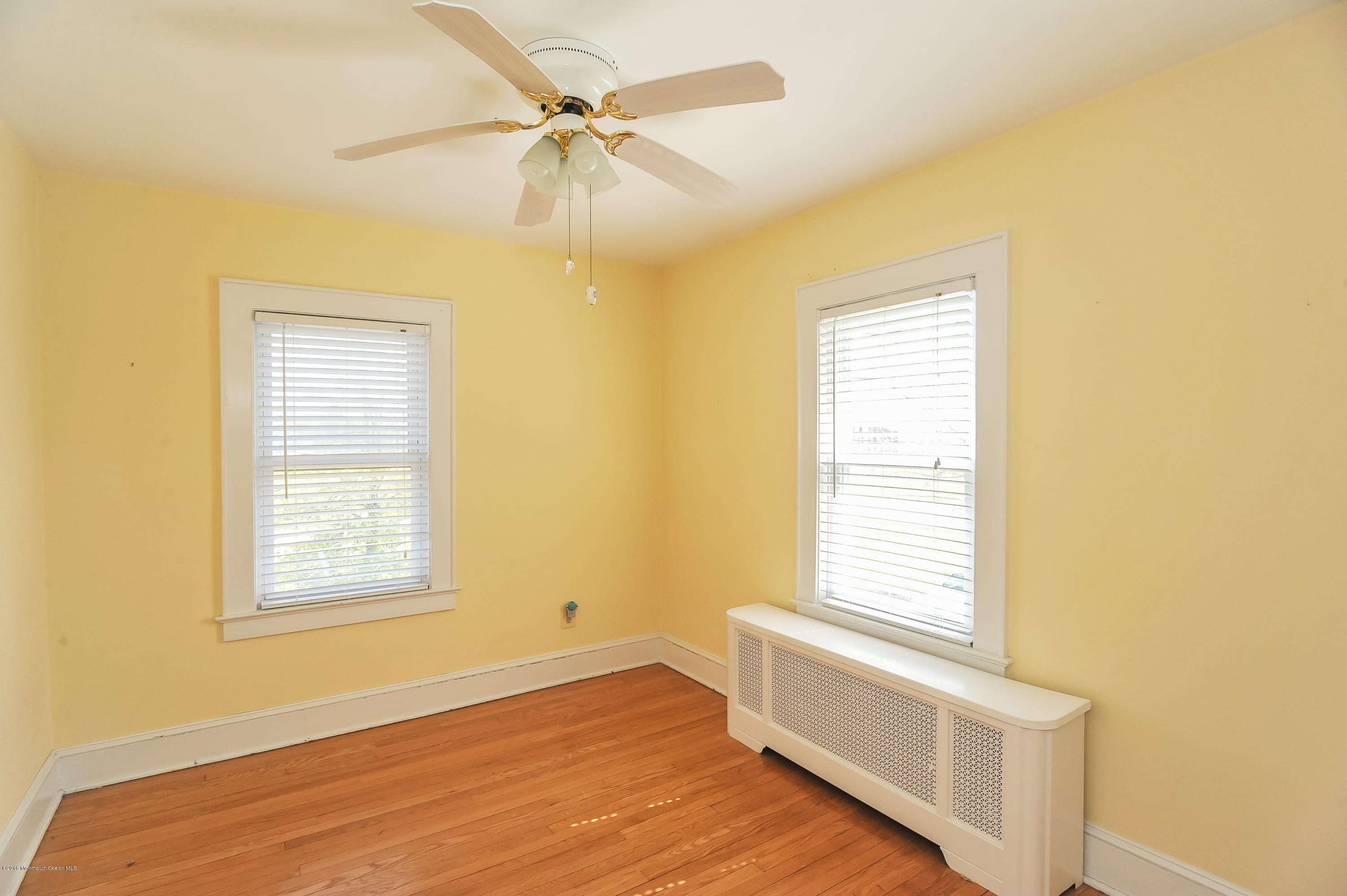 500 Adelphia Road Freehold, NJ 07728 - Photo 20 of 29 a view of an empty room with a window and wooden floor