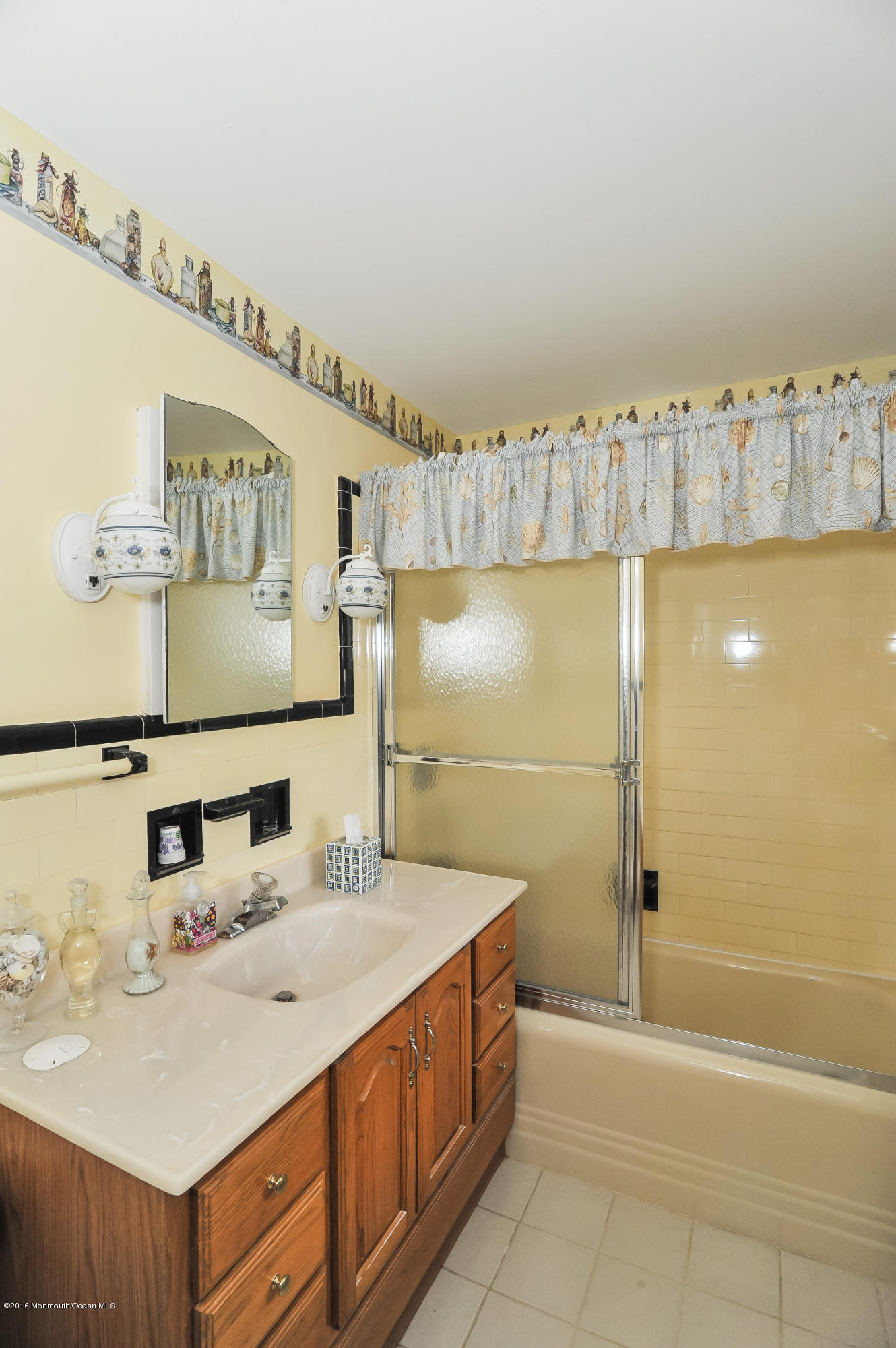 500 Adelphia Road Freehold, NJ 07728 - Photo 22 of 29 a bathroom with a double vanity sink a mirror and a bathtub