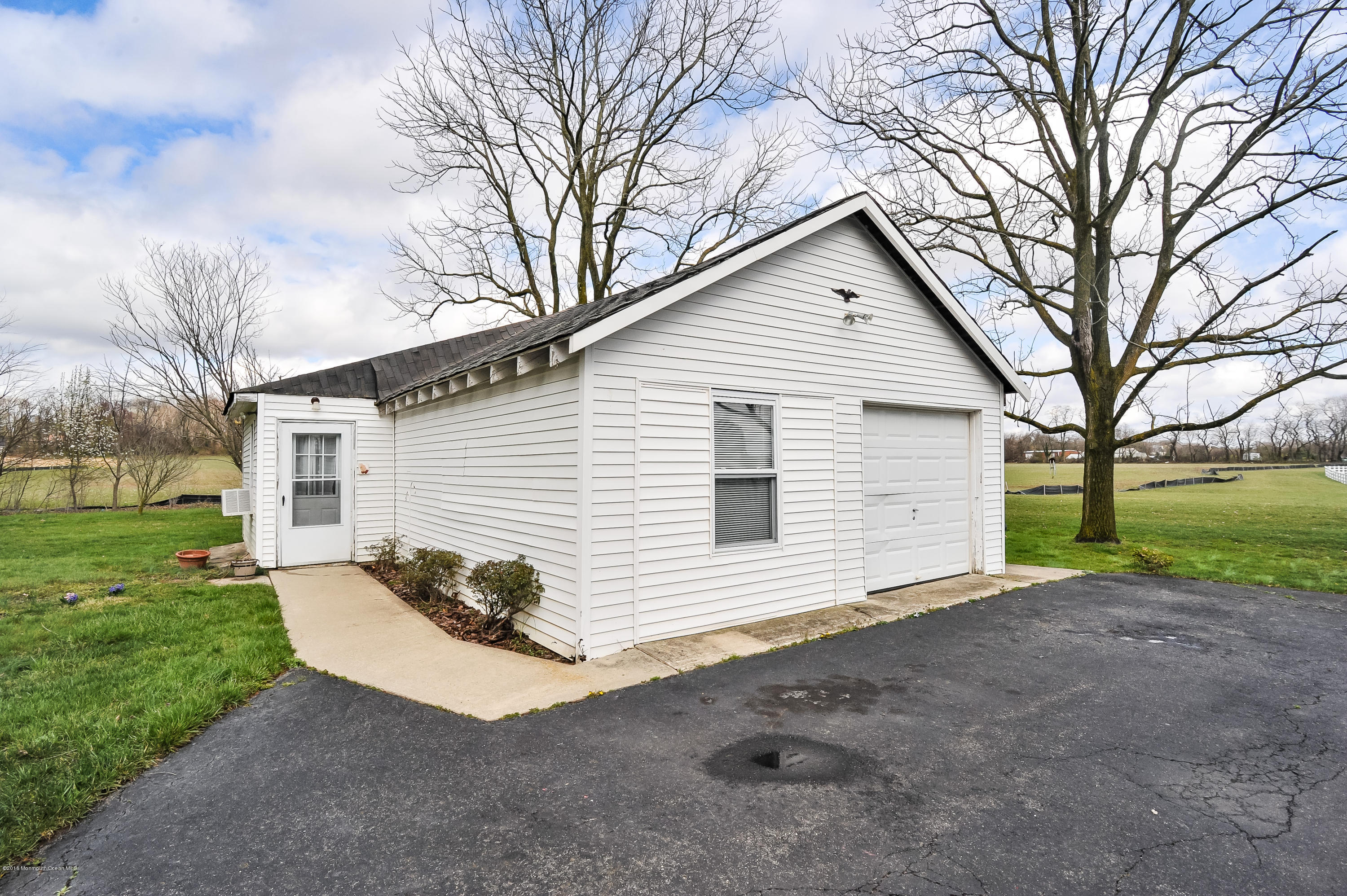 500 Adelphia Road Freehold, NJ 07728 - Photo 23 of 29 a view of a house with yard and a garden
