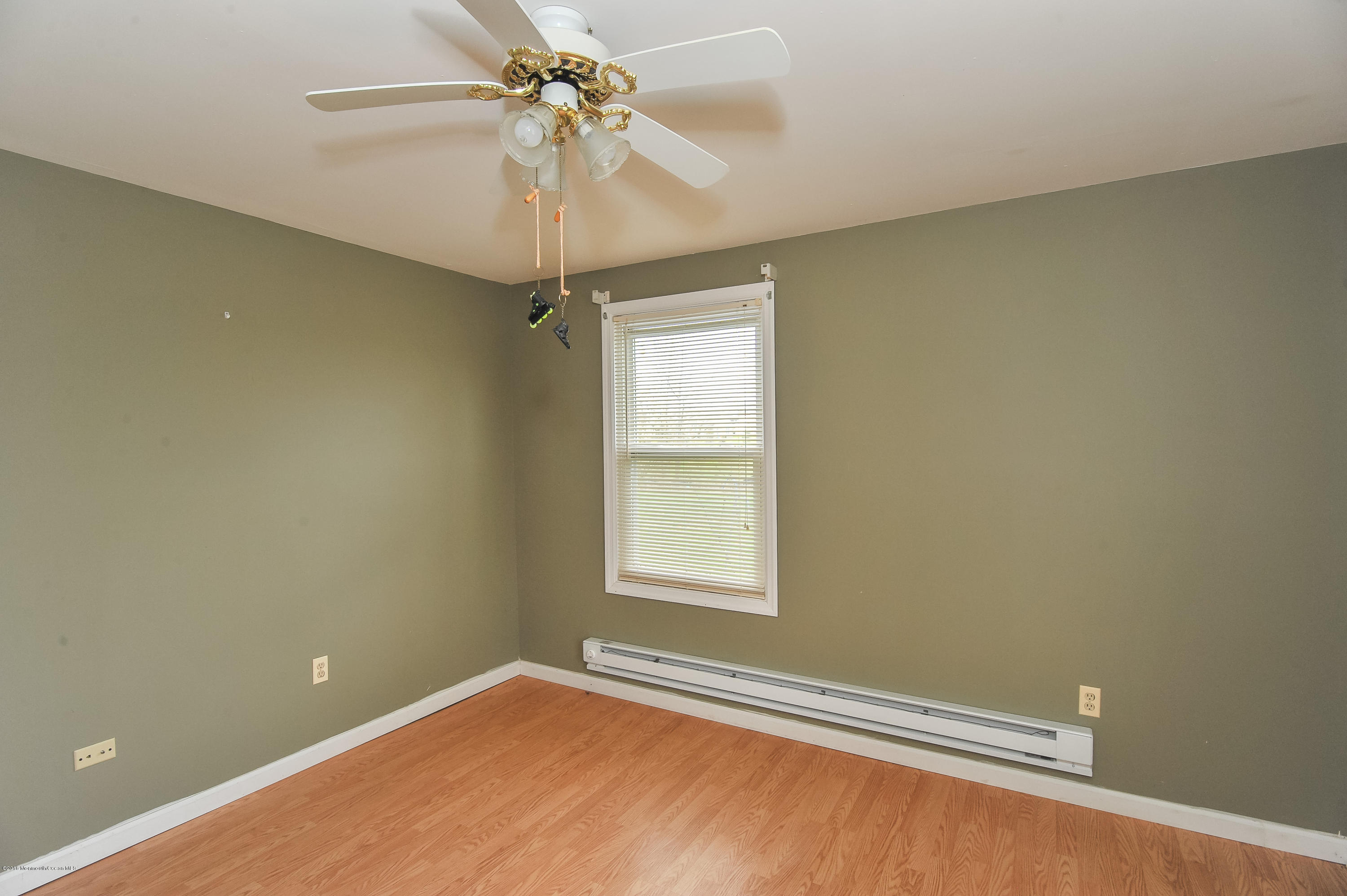 500 Adelphia Road Freehold, NJ 07728 - Photo 25 of 29 an empty room with a window and a fan