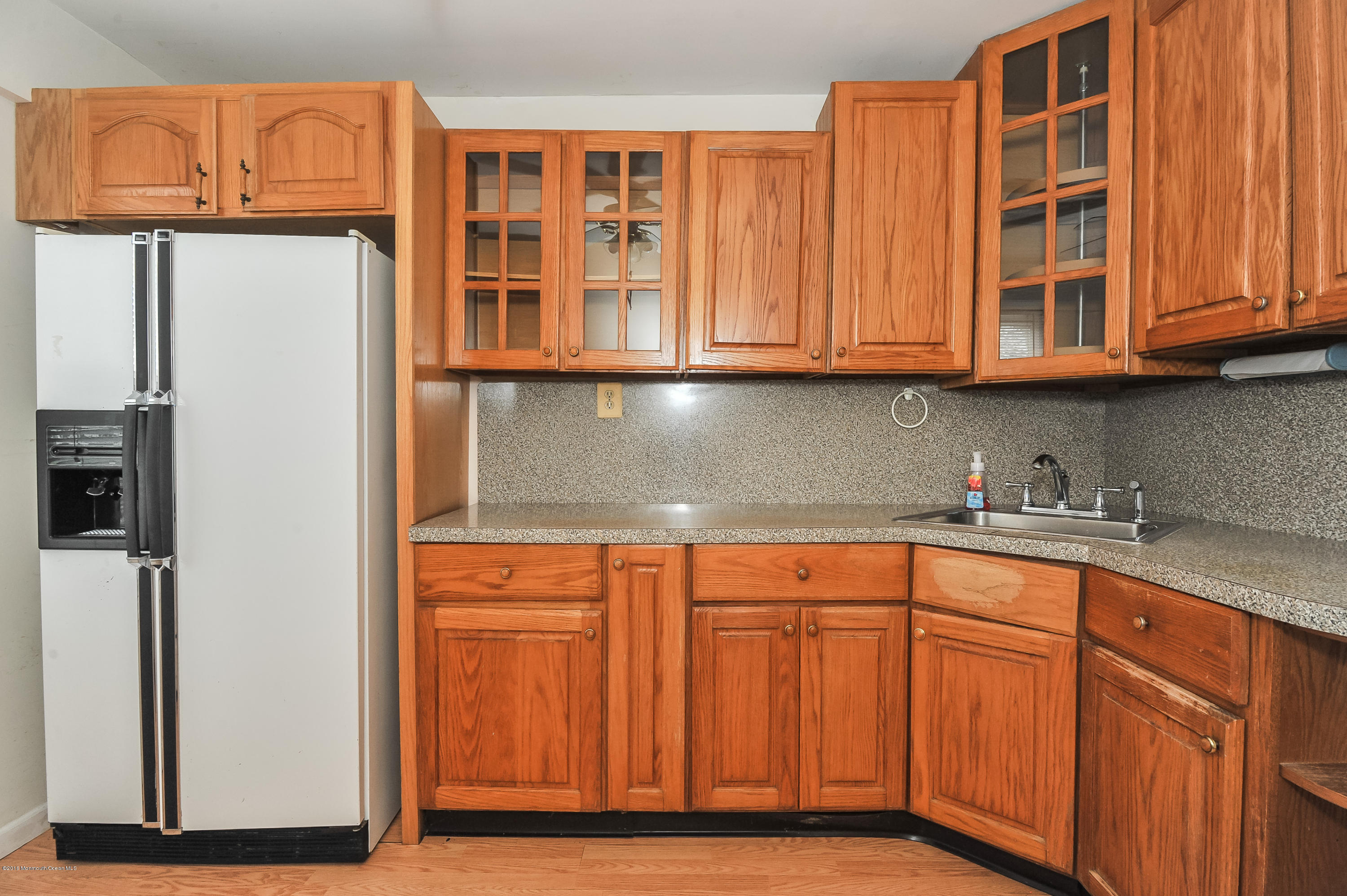 500 Adelphia Road Freehold, NJ 07728 - Photo 27 of 29 a kitchen with stainless steel appliances granite countertop a refrigerator and cabinets