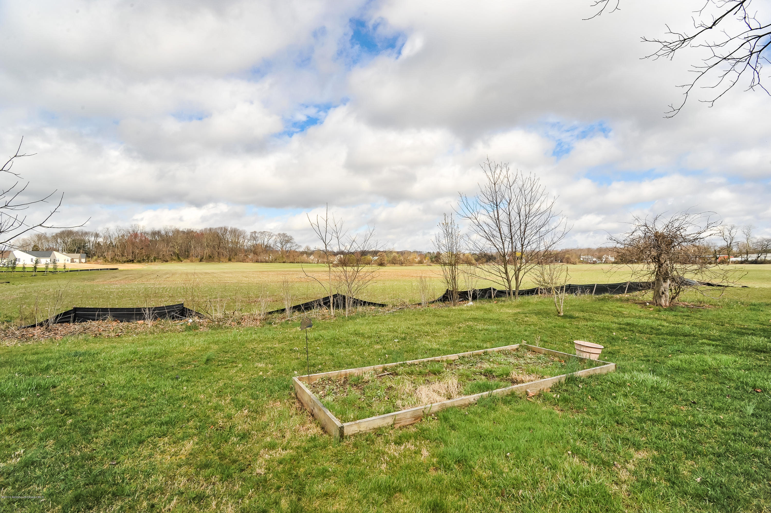 500 Adelphia Road Freehold, NJ 07728 - Photo 29 of 29 a view of a lake with houses in the back