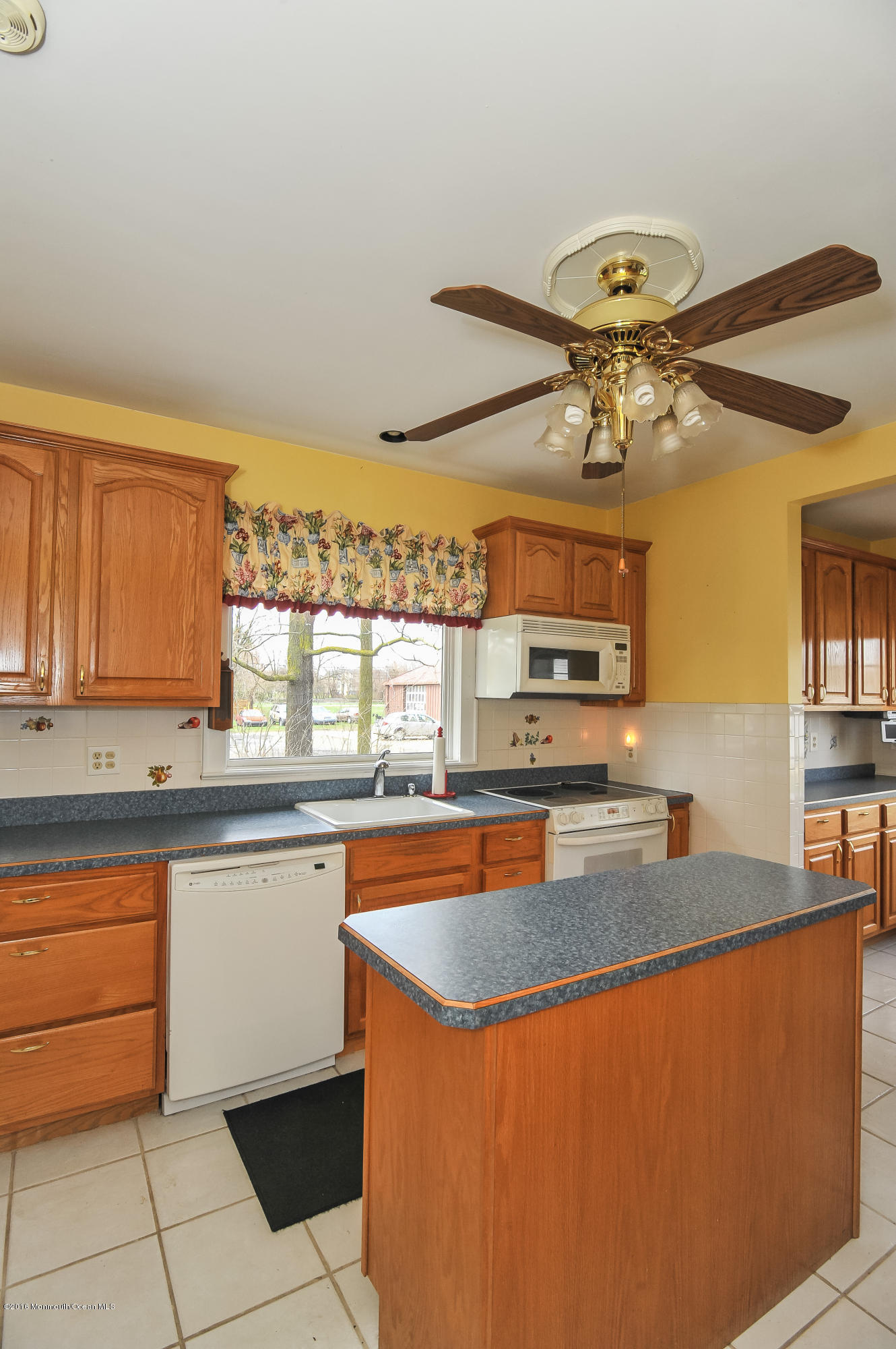 500 Adelphia Road Freehold, NJ 07728 - Photo 5 of 29 a kitchen with stainless steel appliances granite countertop a sink and a stove