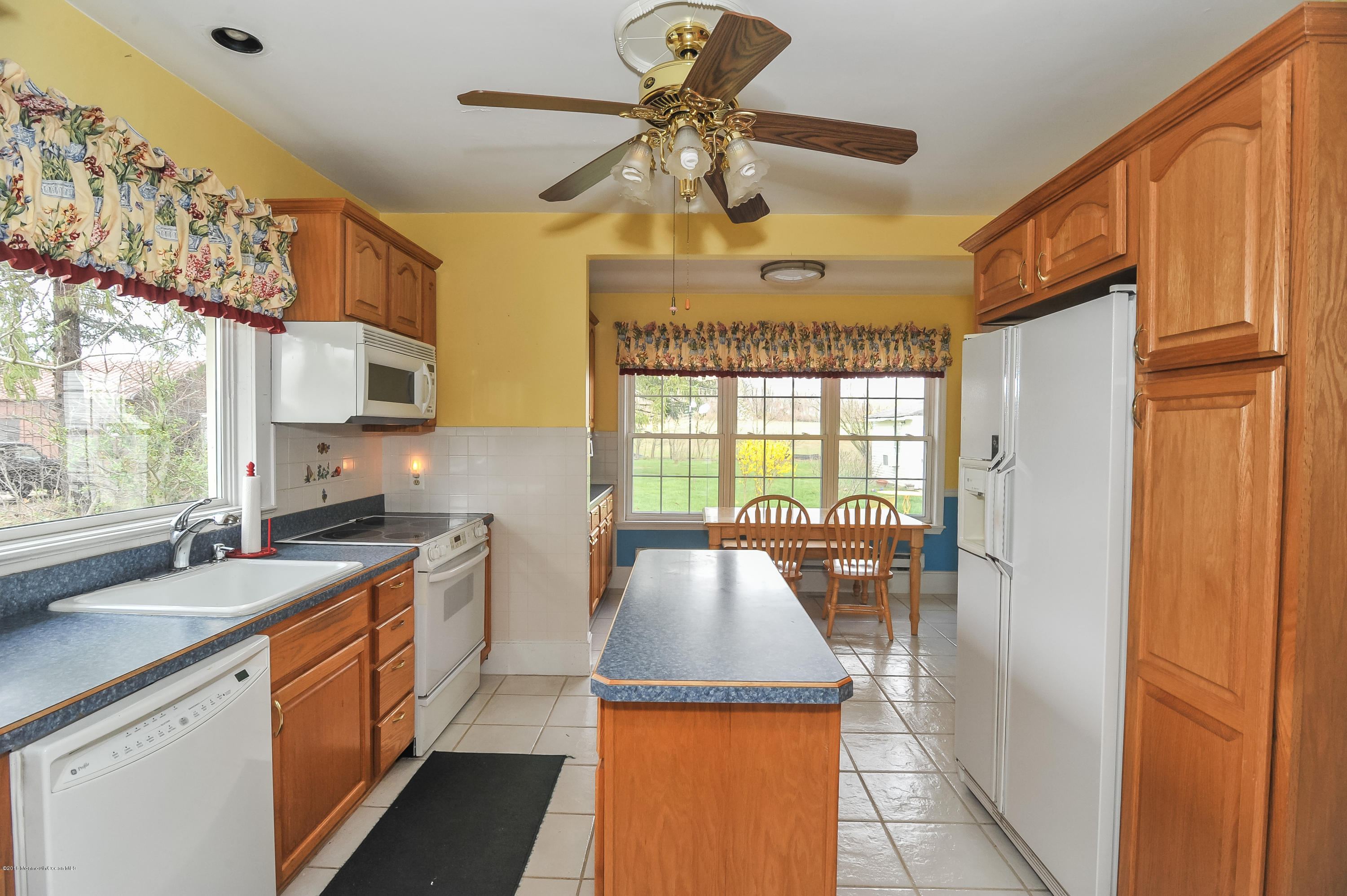 500 Adelphia Road Freehold, NJ 07728 - Photo 6 of 29 a kitchen with a sink a stove and cabinets
