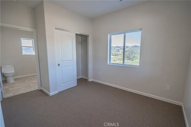 a kitchen with stainless steel appliances granite countertop a sink and a stove