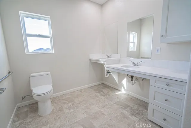 a view of a floor to ceiling window and wooden fence