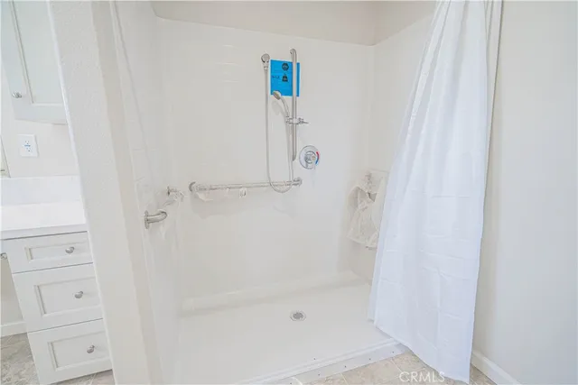 a view of a floor to ceiling window and a yard