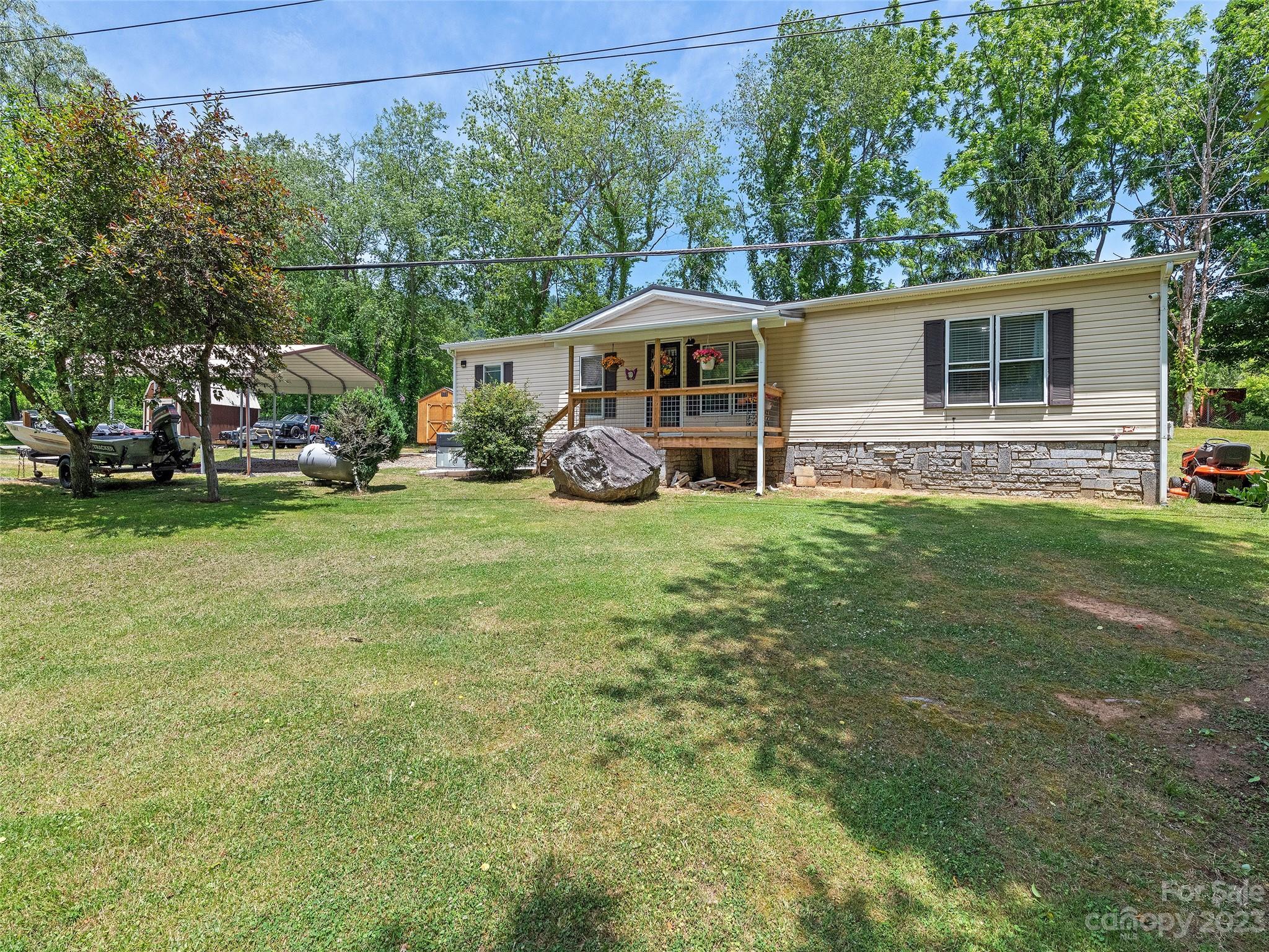 38 Happy Acres Road Waynesville, NC 28785 - Photo 1 of 28 a view of a house with a yard and sitting area