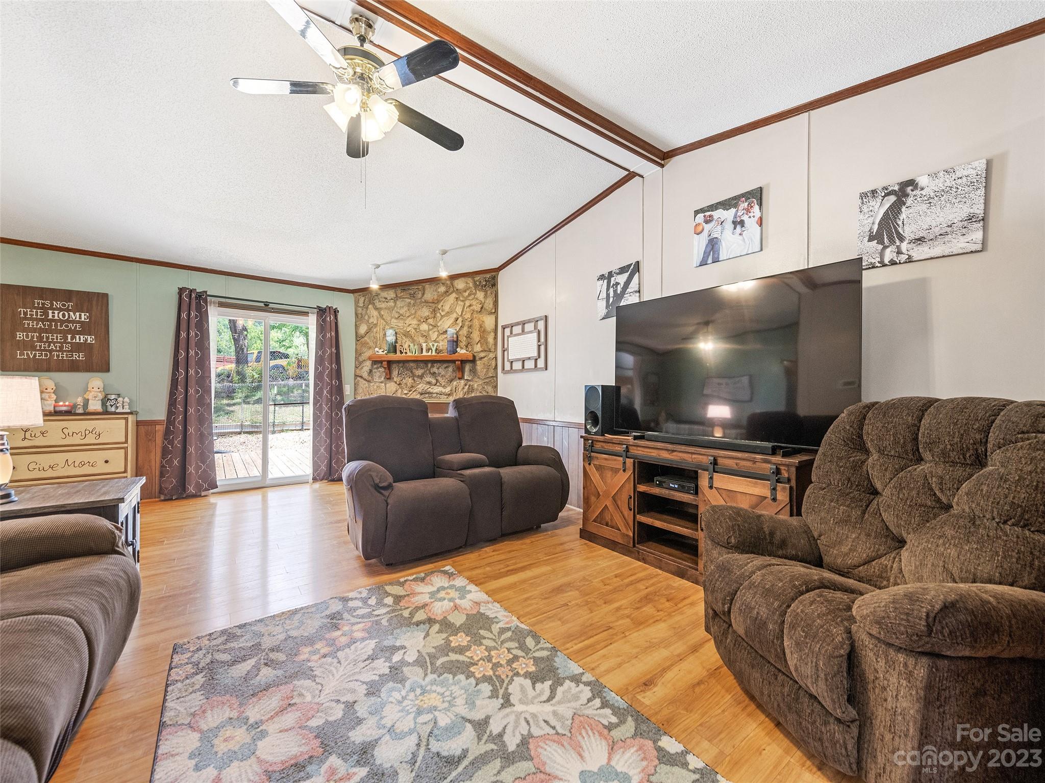 38 Happy Acres Road Waynesville, NC 28785 - Photo 11 of 28 a living room with furniture and a flat screen tv