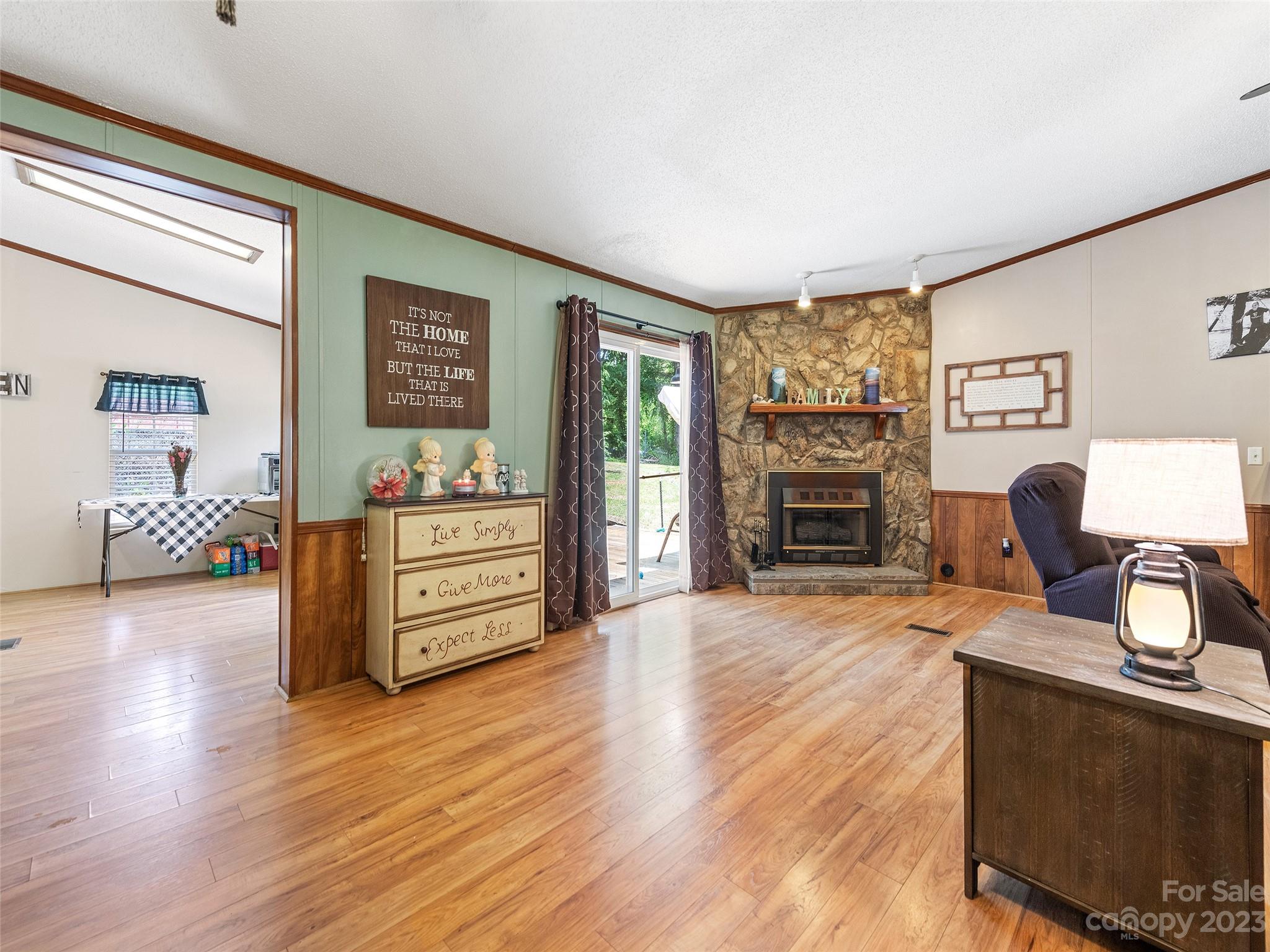 38 Happy Acres Road Waynesville, NC 28785 - Photo 12 of 28 a view of a livingroom with furniture and a flat screen tv