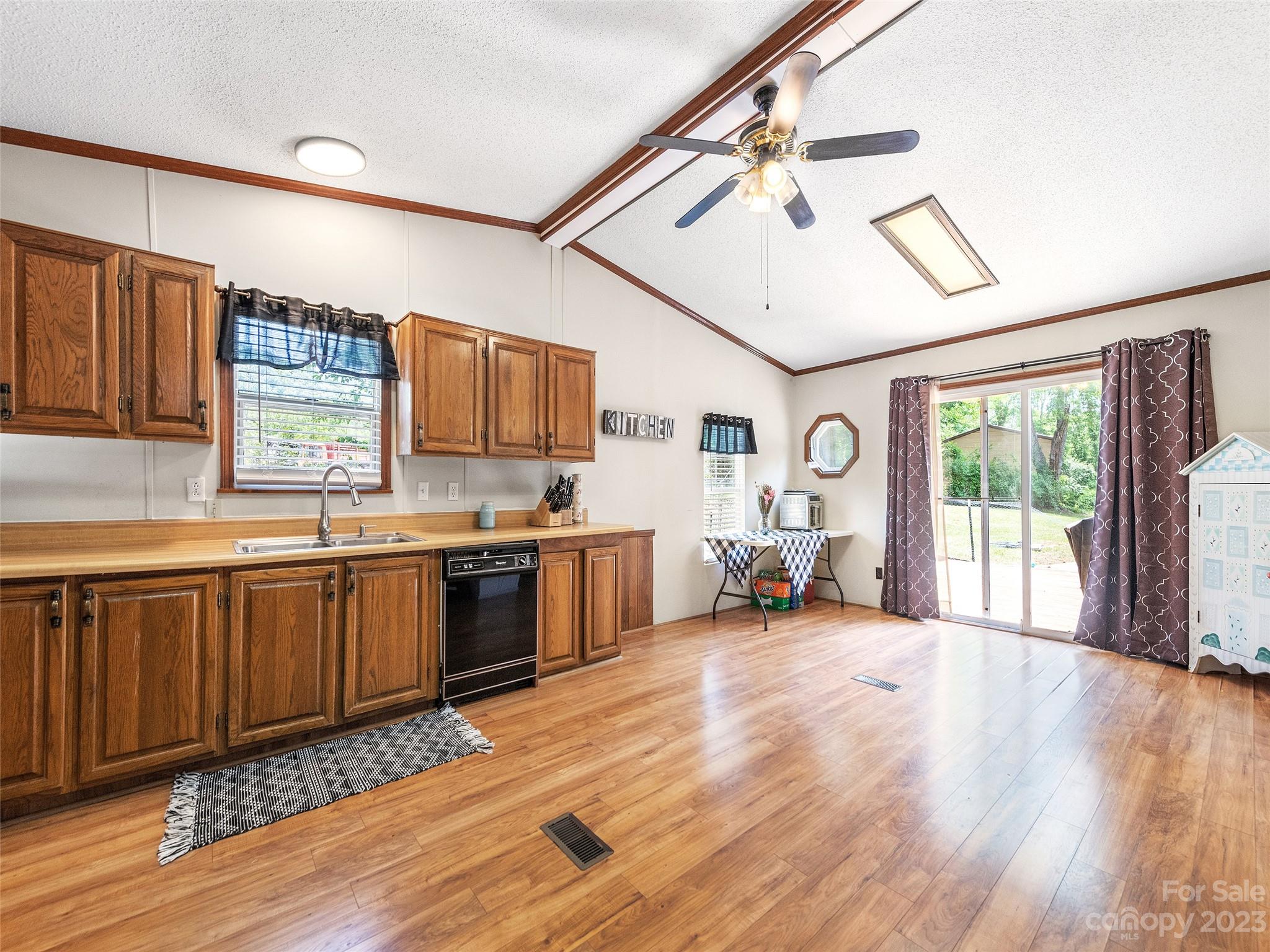 38 Happy Acres Road Waynesville, NC 28785 - Photo 15 of 28 a large white kitchen with sink stove and a refrigerator