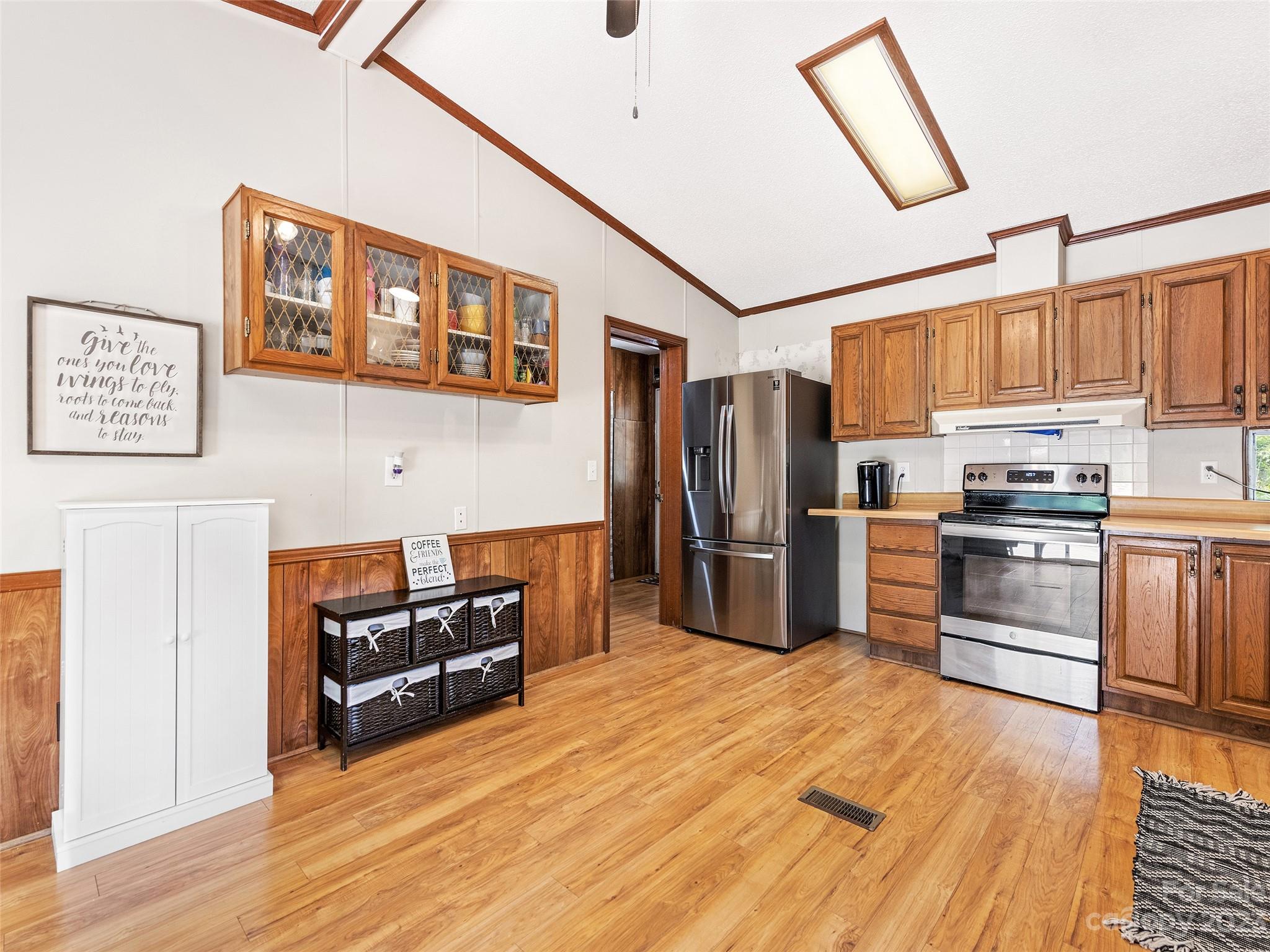 38 Happy Acres Road Waynesville, NC 28785 - Photo 18 of 28 a kitchen with stainless steel appliances a refrigerator and a stove top oven