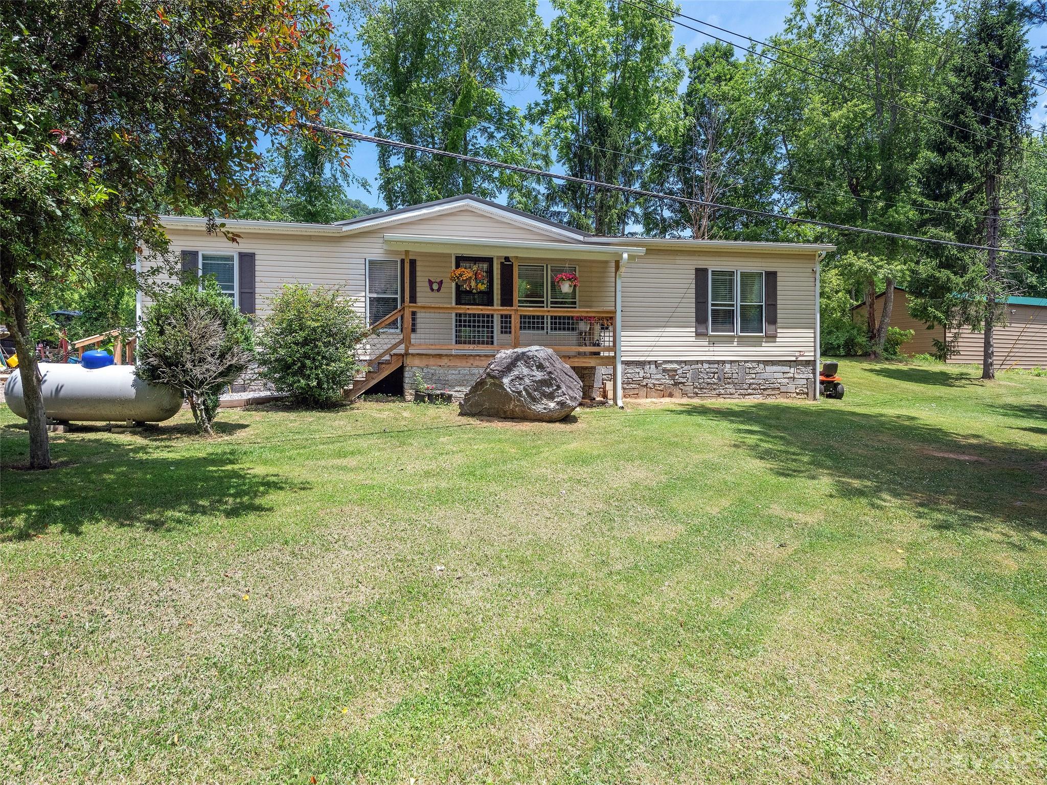 38 Happy Acres Road Waynesville, NC 28785 - Photo 2 of 28 a view of a house with backyard and sitting area