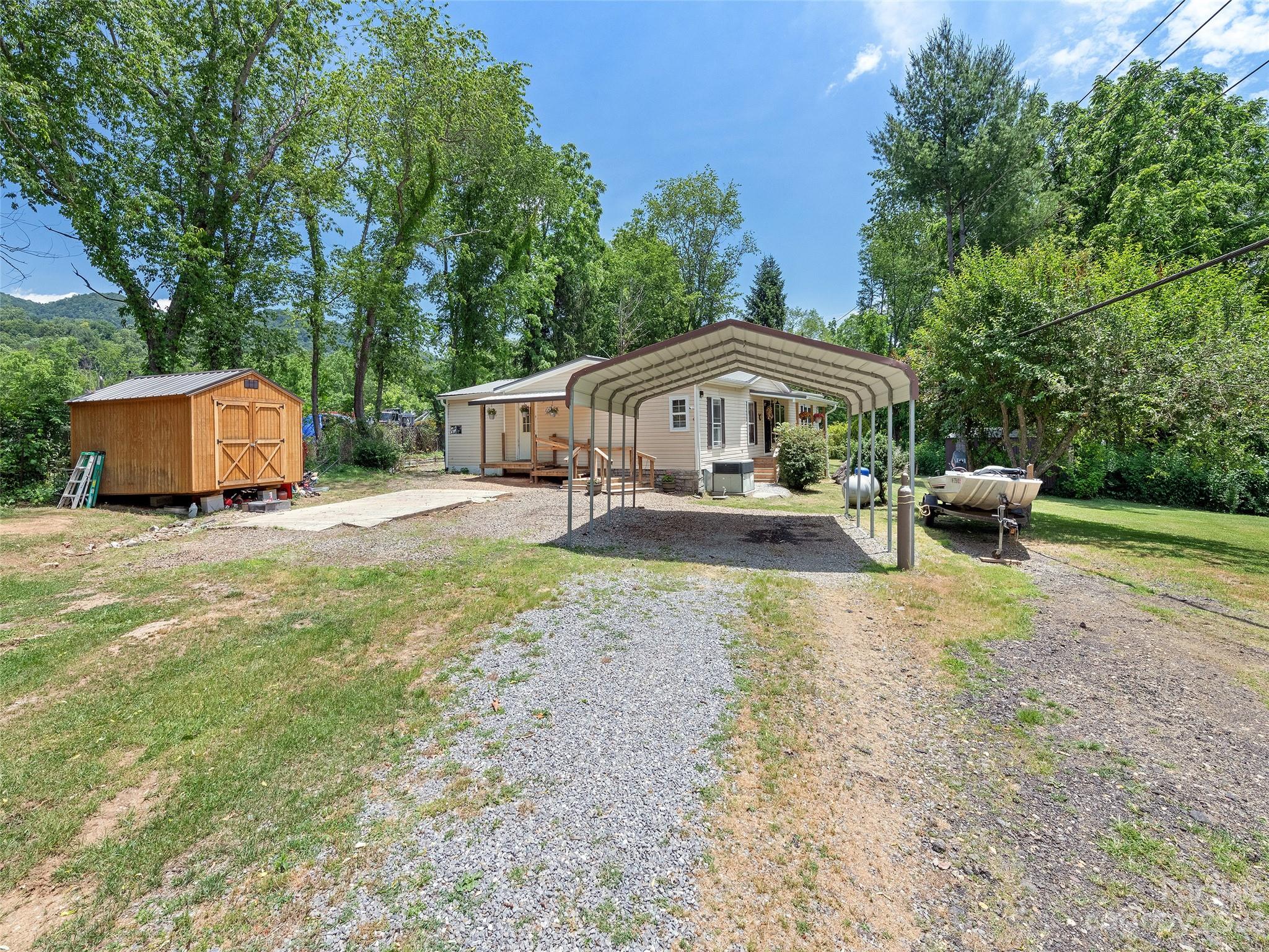 38 Happy Acres Road Waynesville, NC 28785 - Photo 3 of 28 a house view with a garden space