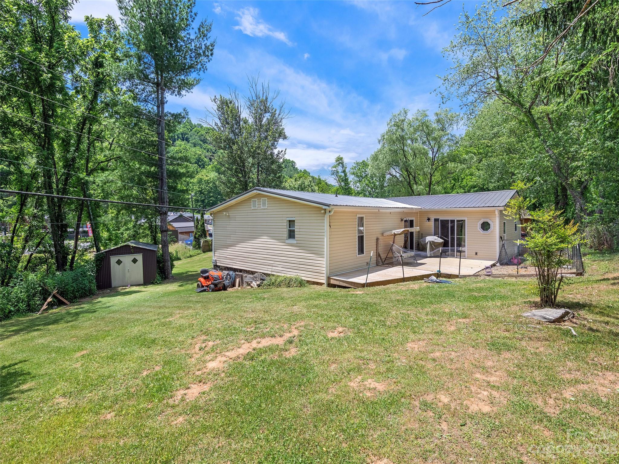 38 Happy Acres Road Waynesville, NC 28785 - Photo 5 of 28 a view of a house with backyard and a tree
