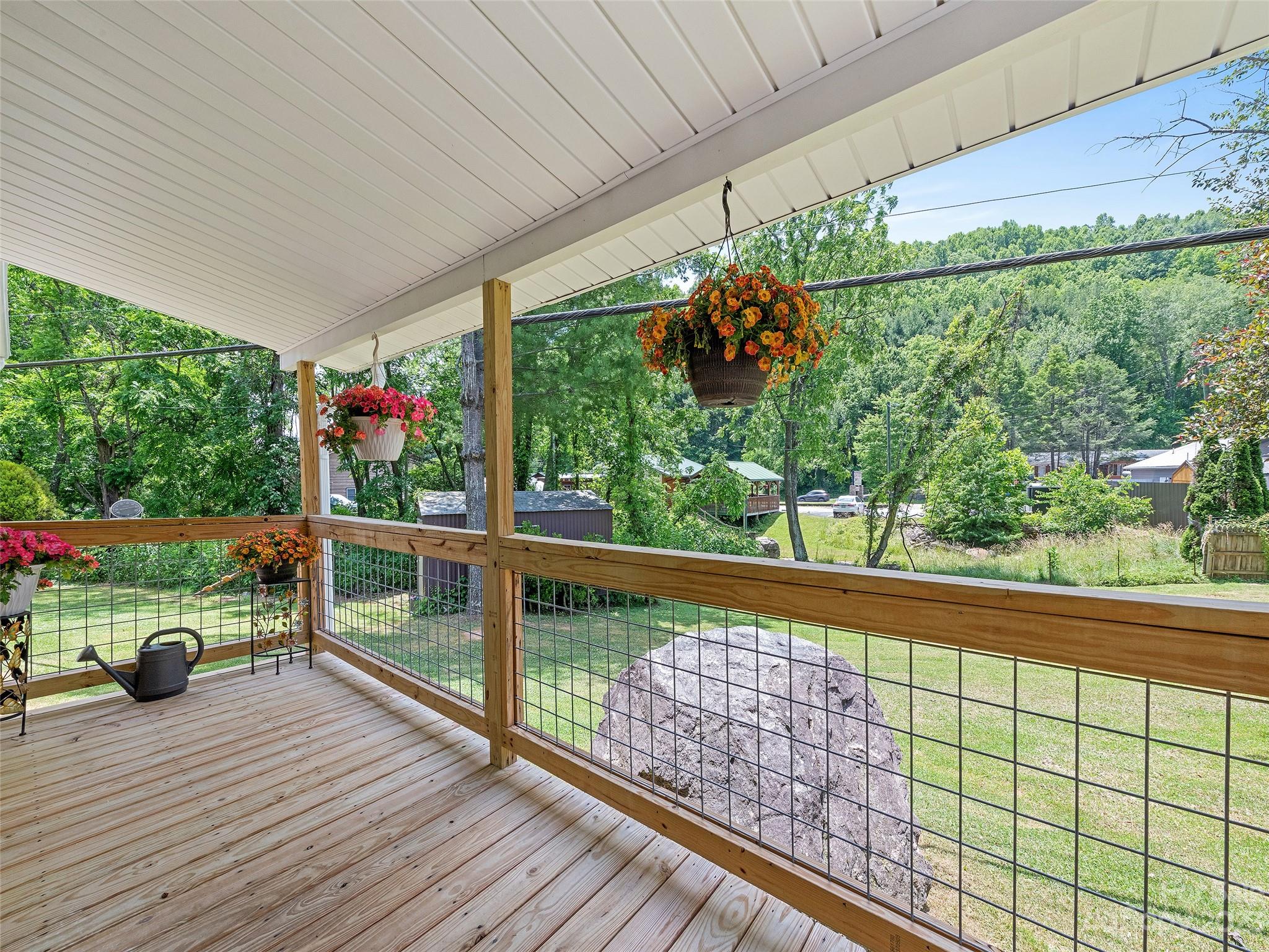 38 Happy Acres Road Waynesville, NC 28785 - Photo 7 of 28 a view of a balcony and yard with wooden floor