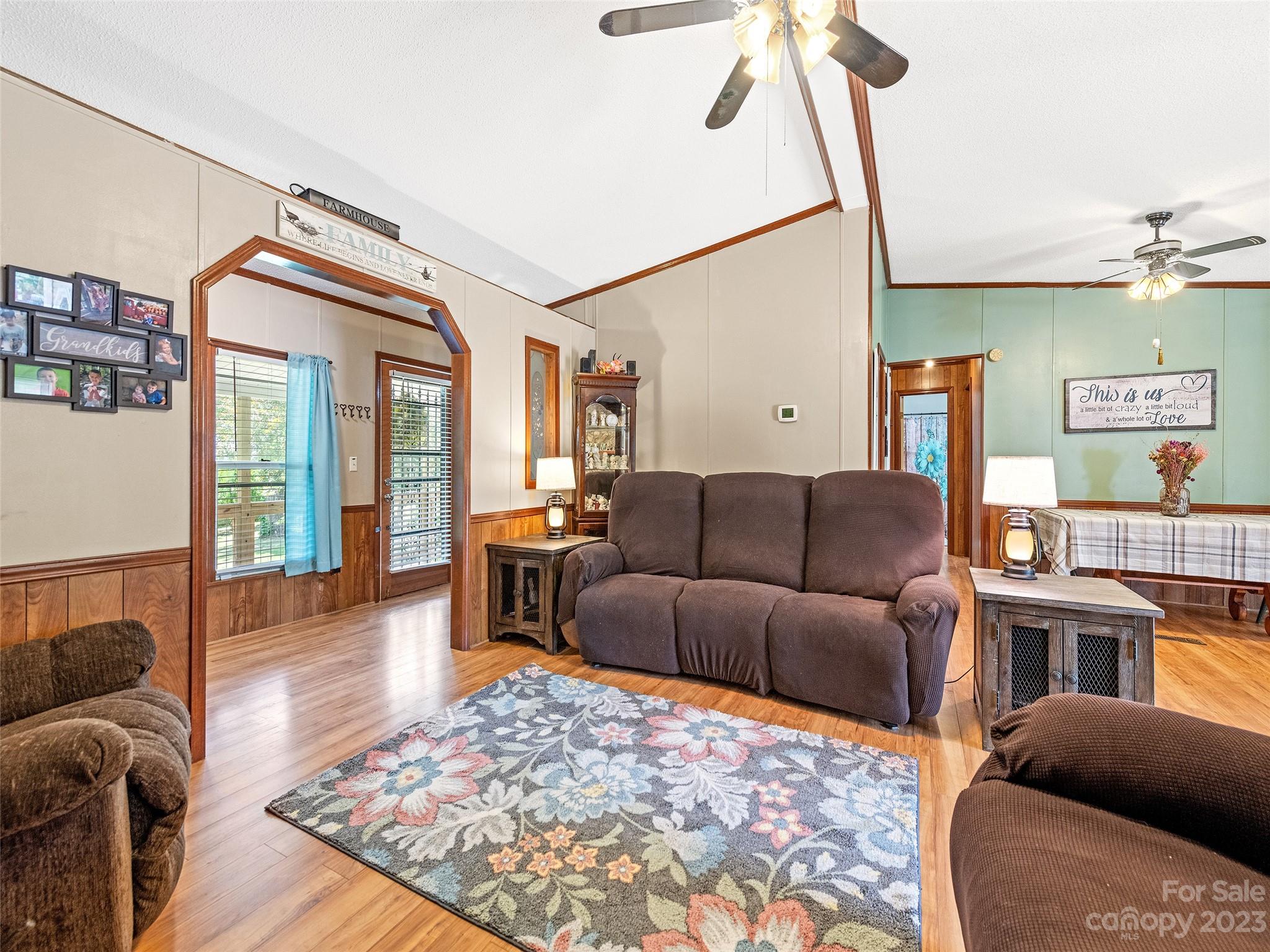 38 Happy Acres Road Waynesville, NC 28785 - Photo 9 of 28 a living room with furniture a rug and a chandelier