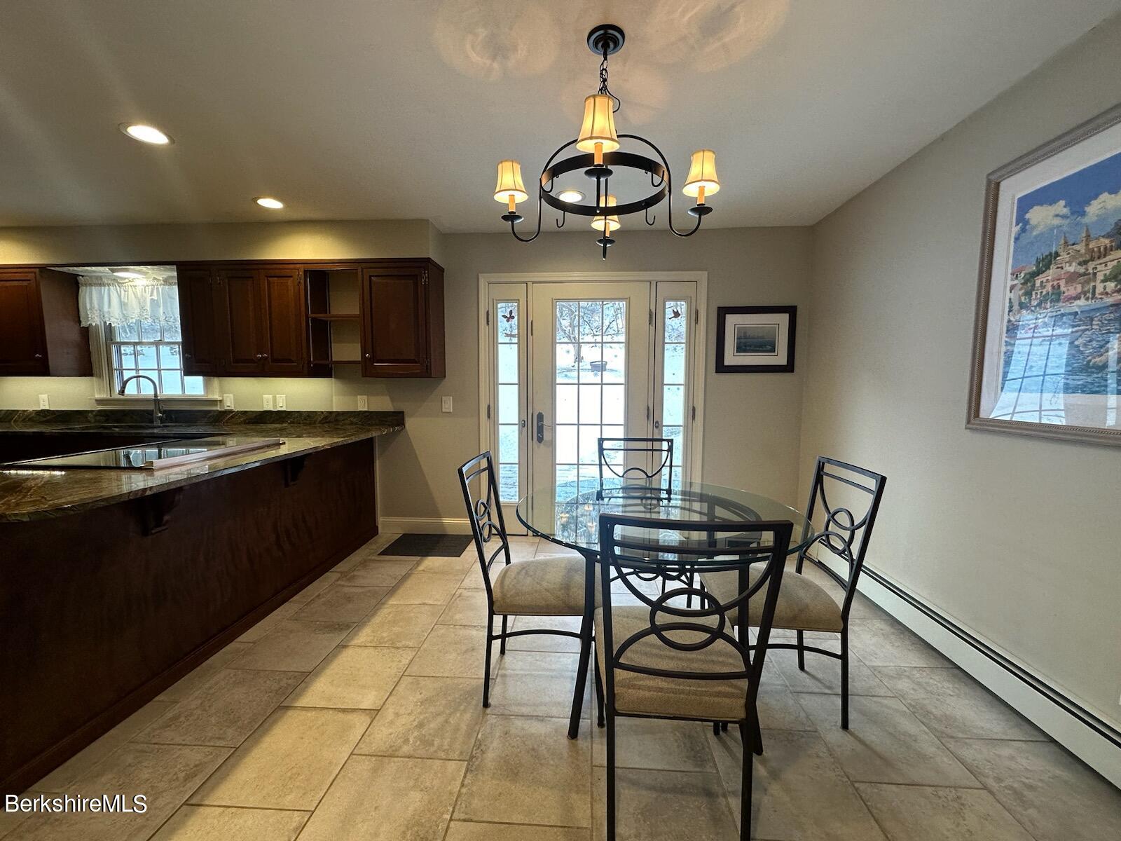 1172 Bluestone Road Bennington, VT 05201 - Photo 11 of 52 a view of a dining room with furniture and chandelier