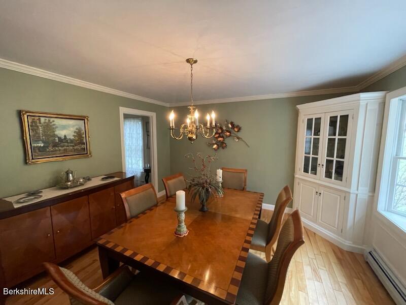 1172 Bluestone Road Bennington, VT 05201 - Photo 13 of 52 a view of a dining room with furniture window and wooden floor