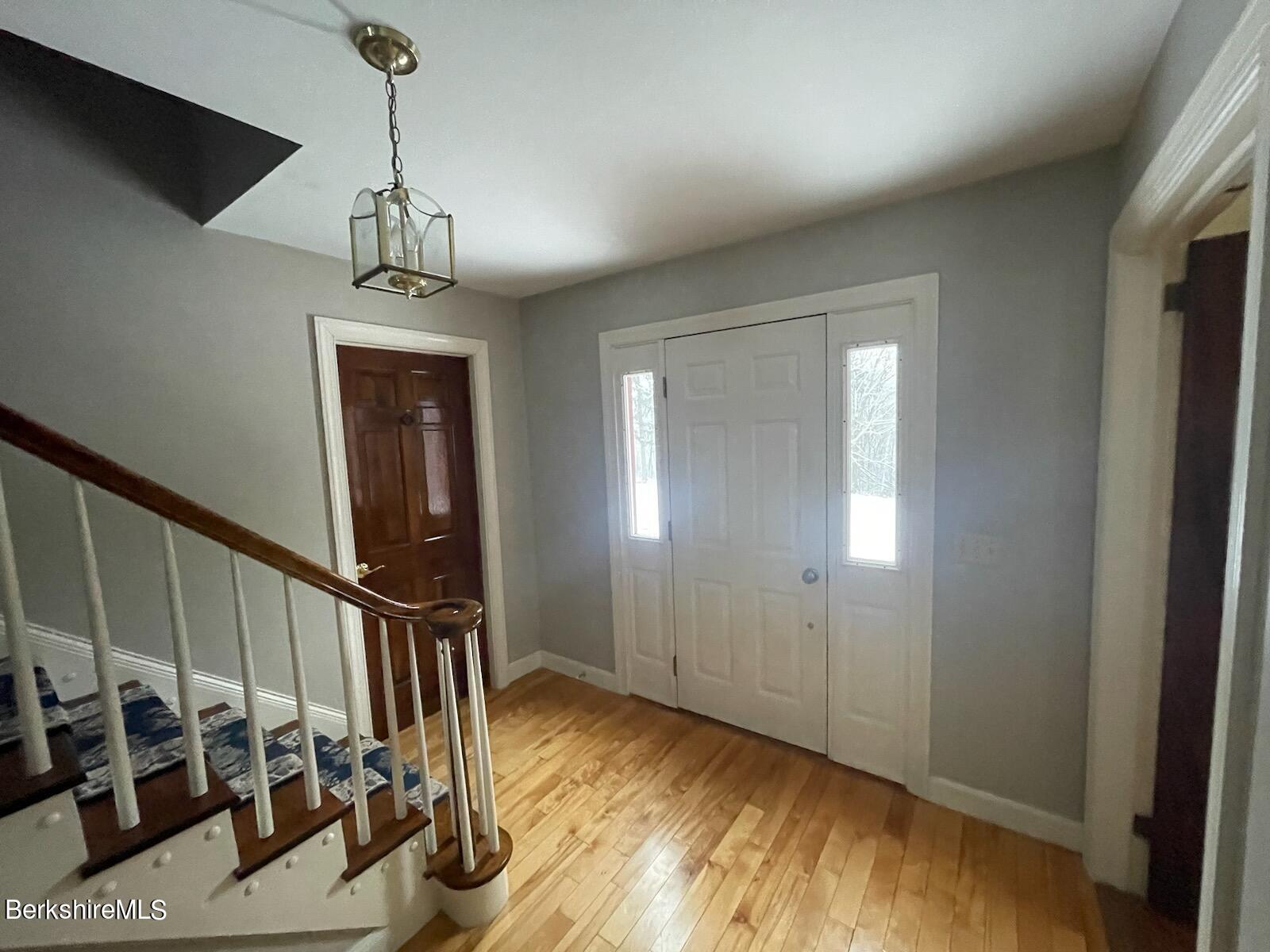 1172 Bluestone Road Bennington, VT 05201 - Photo 17 of 52 a view of a room with wooden floor and staircase