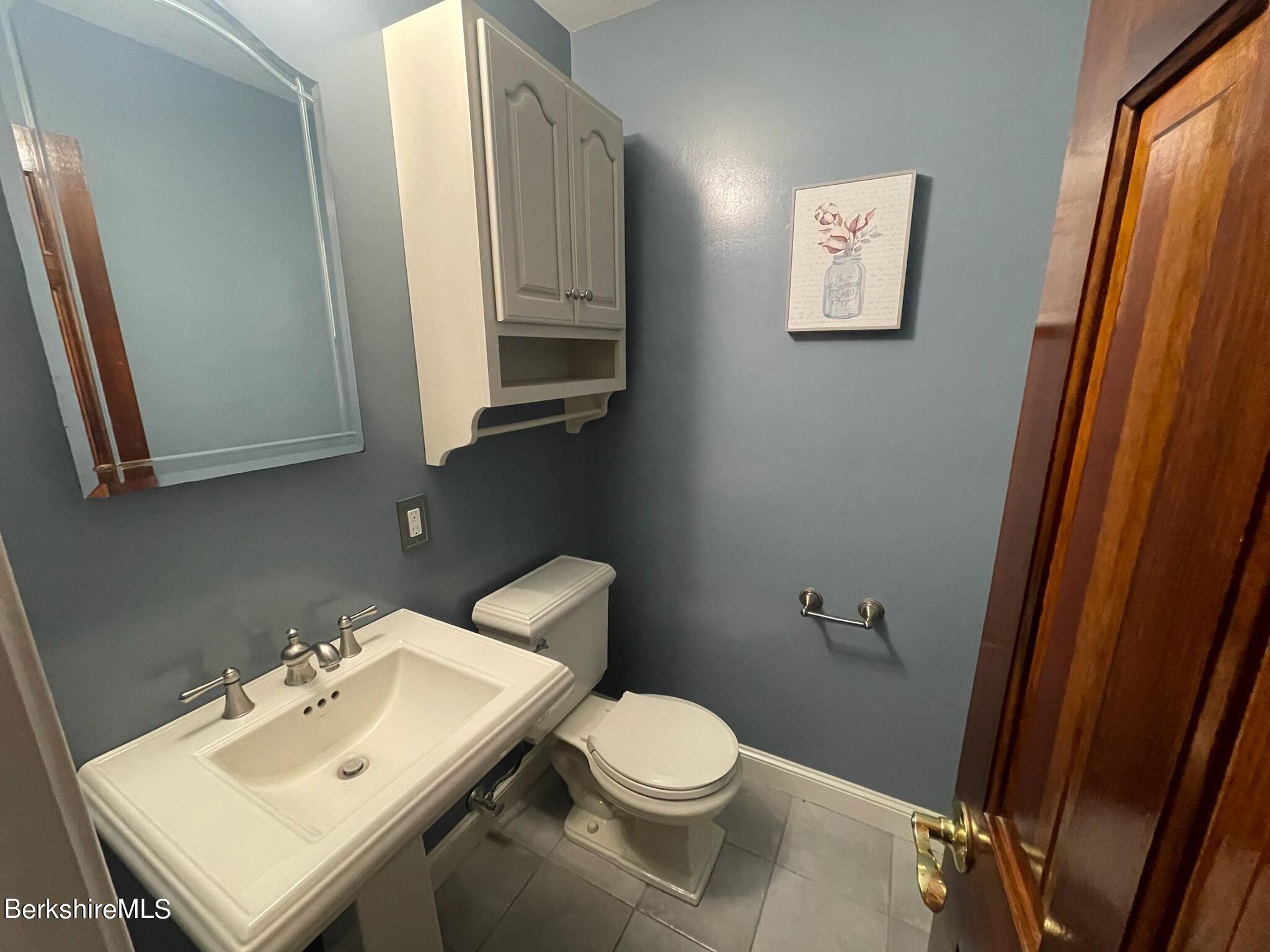 1172 Bluestone Road Bennington, VT 05201 - Photo 21 of 52 a white toilet sitting next to a bathroom sink