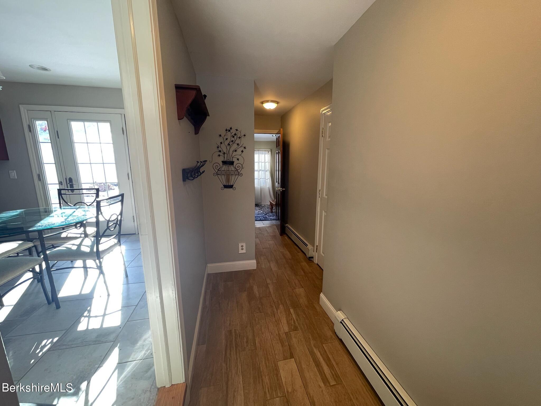 1172 Bluestone Road Bennington, VT 05201 - Photo 22 of 52 a view of a hallway with wooden floor and staircase