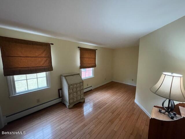 1172 Bluestone Road Bennington, VT 05201 - Photo 33 of 52 a view of an empty room with wooden floor and windows