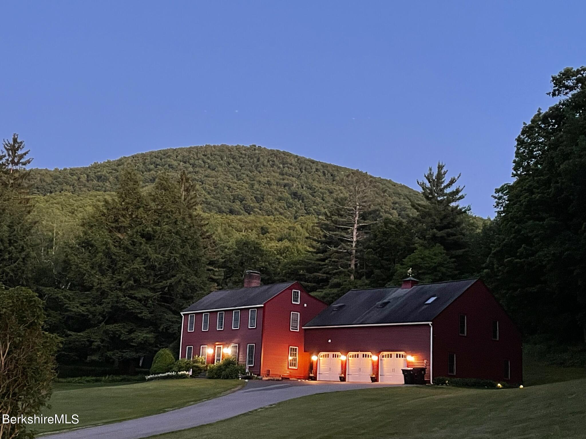 1172 Bluestone Road Bennington, VT 05201 - Photo 5 of 52 a view of a big house in a big yard with large trees