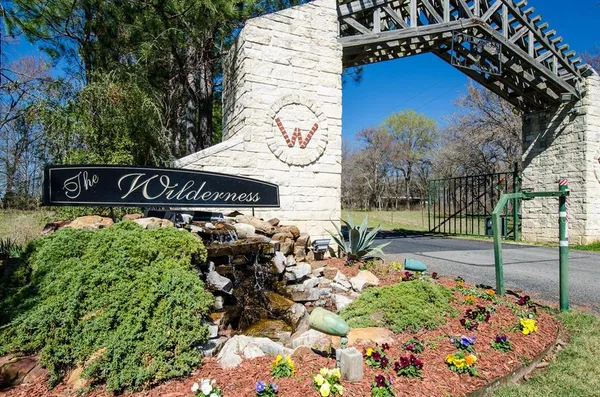 a street sign on a sidewalk next to a road
