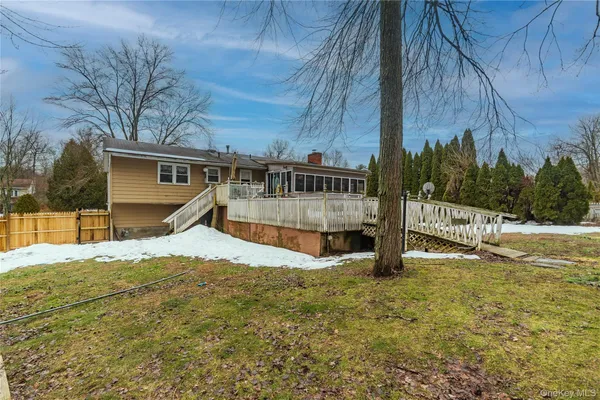 a view of backyard with deck