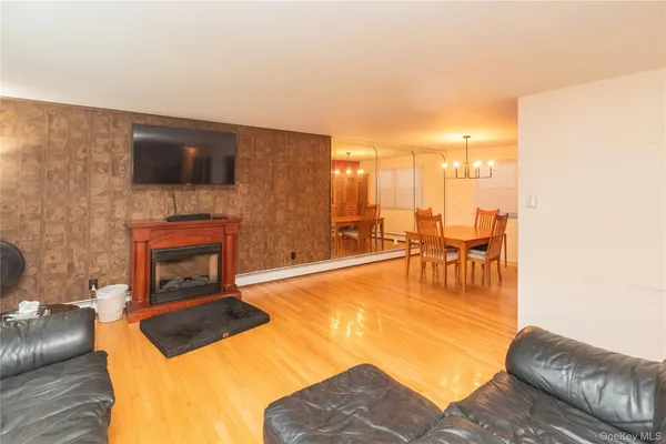 a dining room with furniture and window