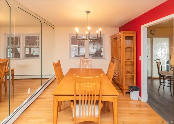 a living room with furniture a swimming pool and a large window