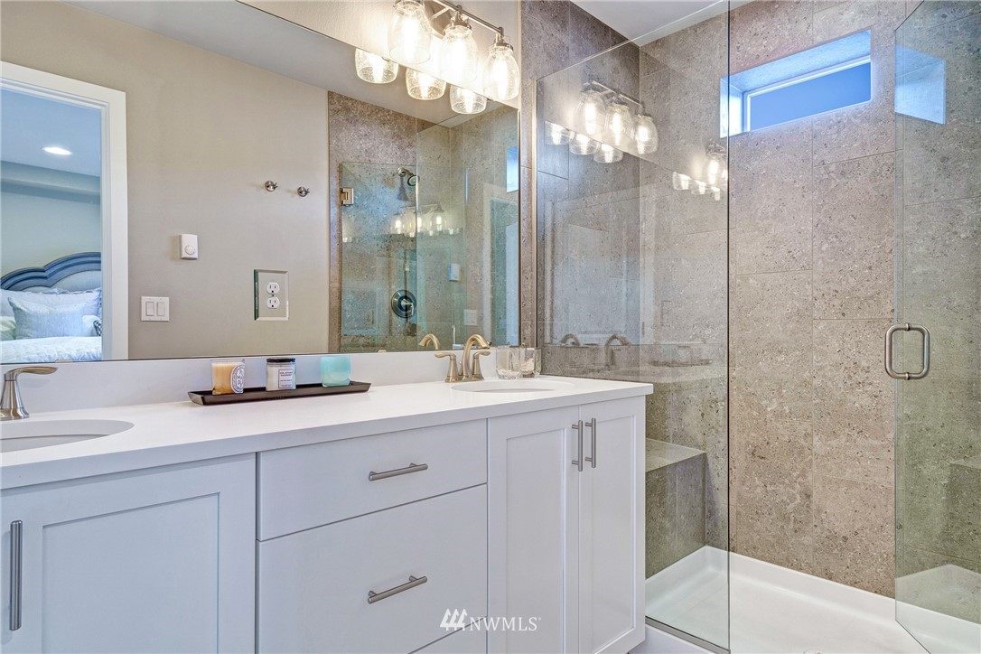 606 237th Street Southeast, Unit C Bothell, WA 98021 - Photo 17 of 27 a bathroom with a sink double vanity and a mirror