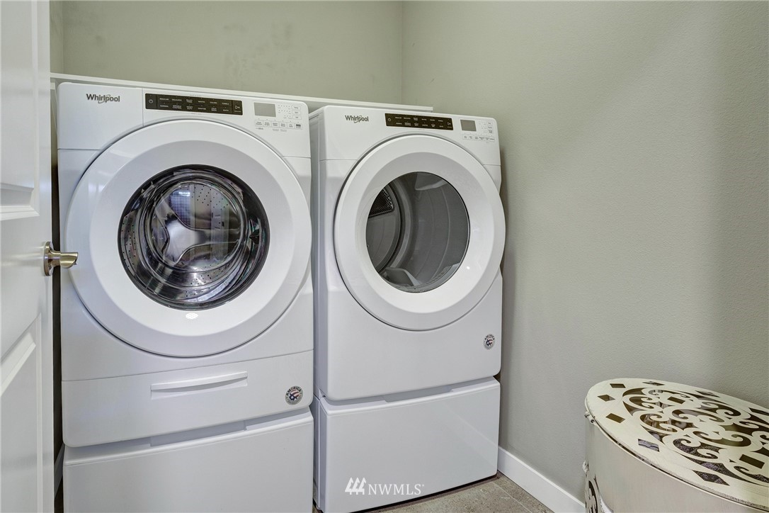 606 237th Street Southeast, Unit C Bothell, WA 98021 - Photo 21 of 27 a utility room with dryer and washer