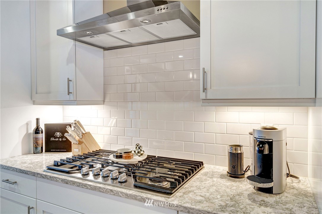 606 237th Street Southeast, Unit C Bothell, WA 98021 - Photo 9 of 27 a kitchen with a stove and a refrigerator
