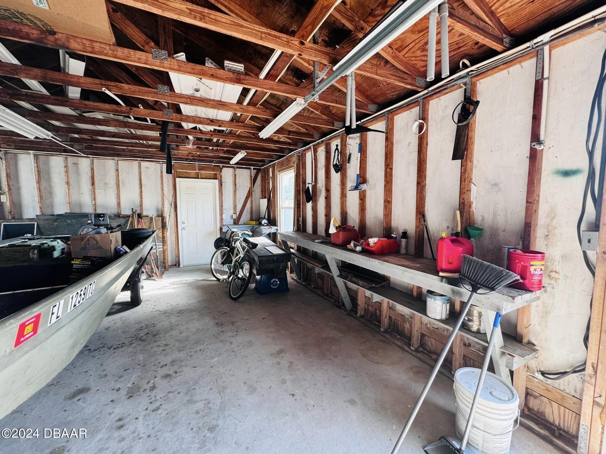 12 Berkley Road Ormond Beach, FL 32176 - Photo 30 of 44 garage work bench