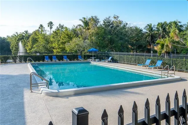 a view of a swimming pool with a patio