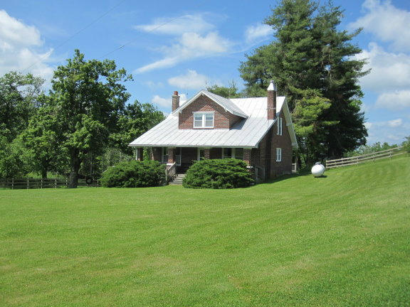 3404 Black Ridge Road Southwest Floyd, VA 24091 - Photo 3 of 39 a front view of a house with garden