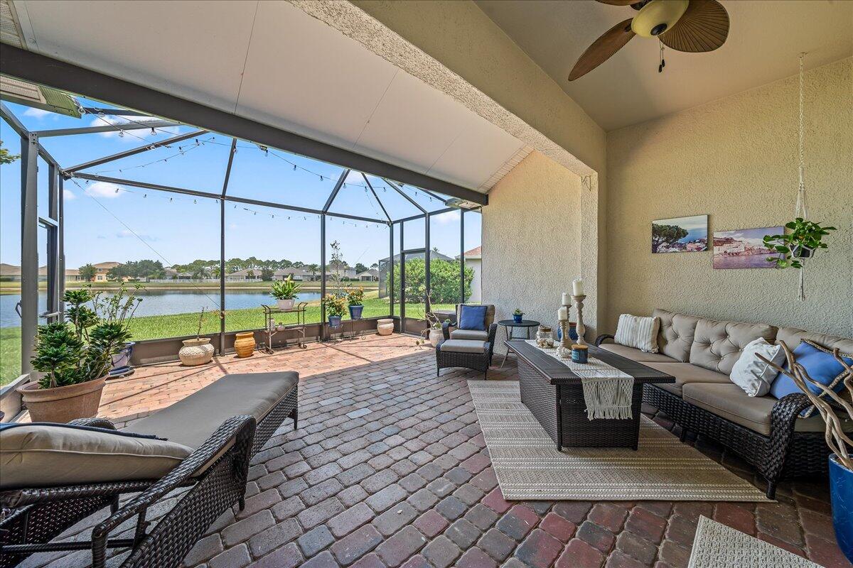 337 Abernathy Circle Palm Bay, FL 32909 - Photo 13 of 51 a living room with furniture and a floor to ceiling window